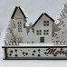 White Wood Christmas Light up Decoration Featuring a Village Scene With Tree and Houses. Laser Cut Wood is Hand Assembled With LED Lights. UK