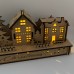 Wooden Christmas Light up Decoration Featuring a Village Scene With Tree and Houses. Laser Cut Wood is Hand Assembled With LED Lights. UK