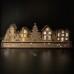 Wooden Christmas Light up Decoration Featuring a Village Scene With Tree and Houses. Laser Cut Wood is Hand Assembled With LED Lights. UK